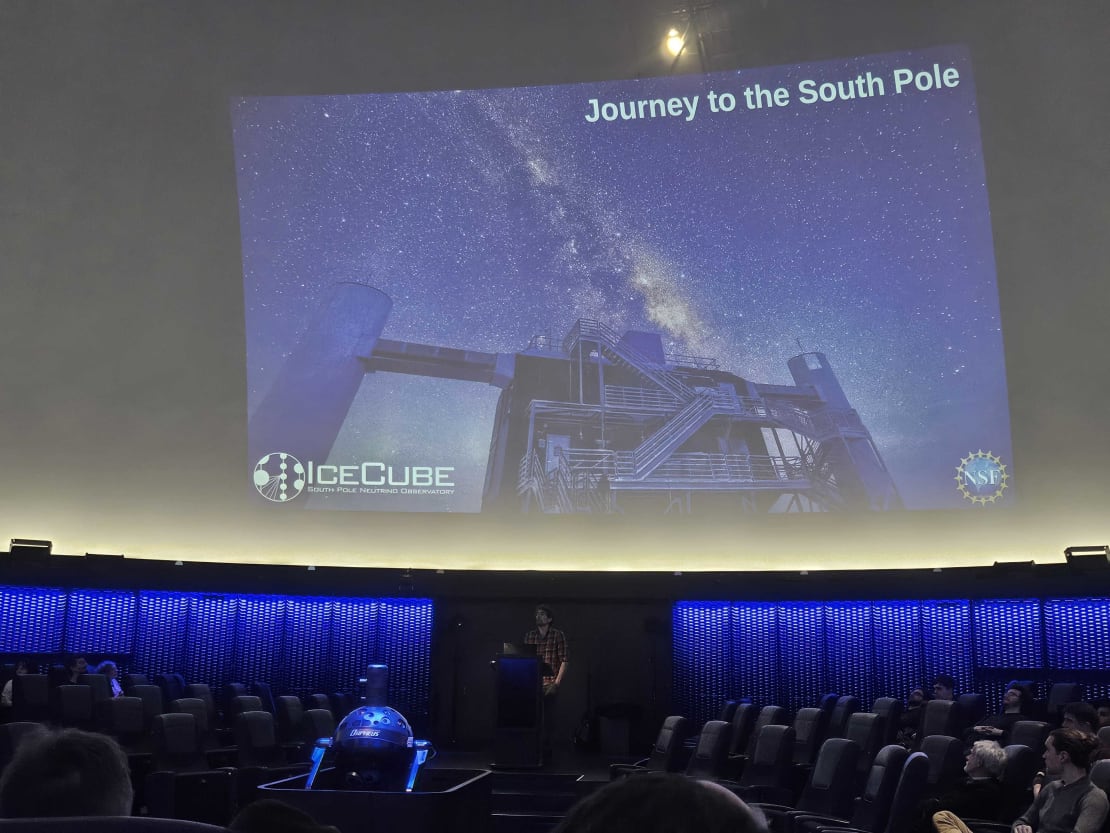 A movie playing inside of a planetarium
