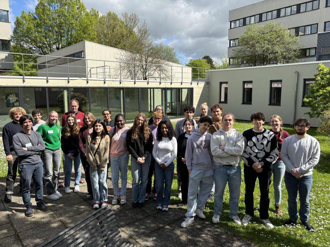 A group of people posing outside