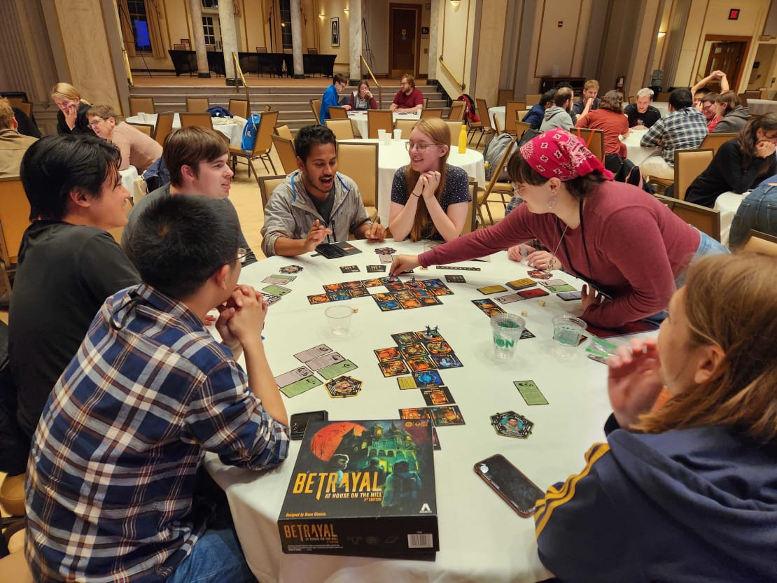 A group of people playing a boardgame