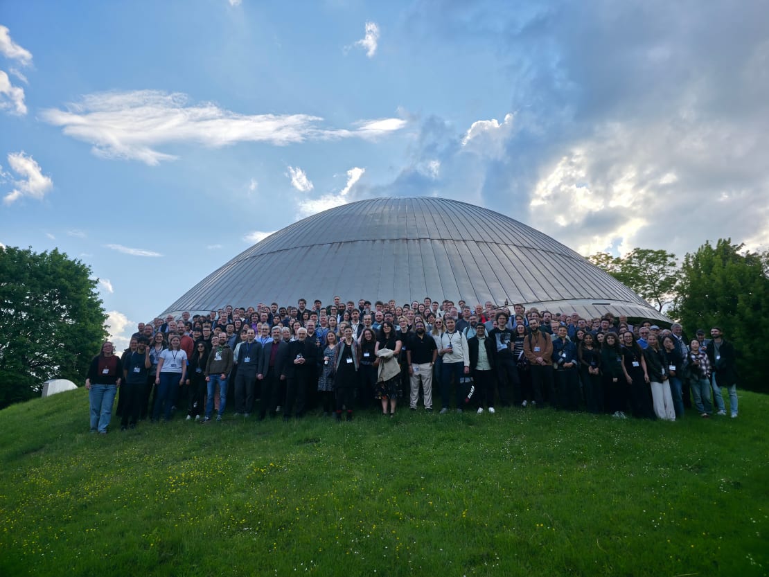 A group of people posing for a photo in front of the Planetarium Bochum.