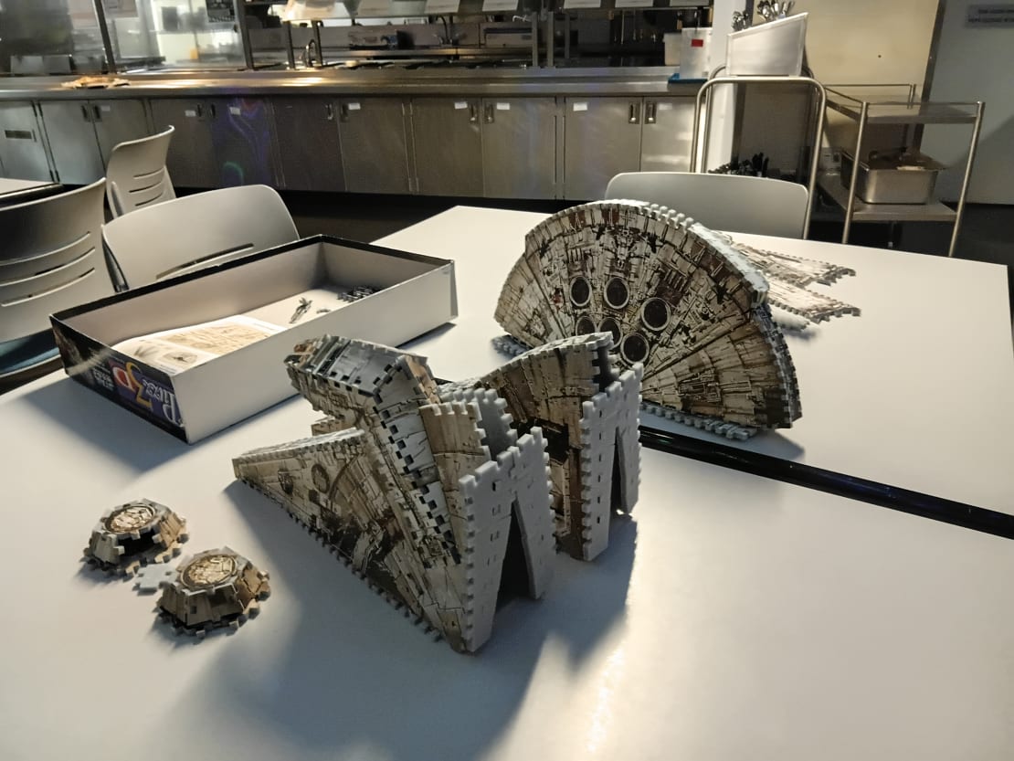 Close-up of nearly complete 3D puzzle of the Millennium Falcon from Star Wars.