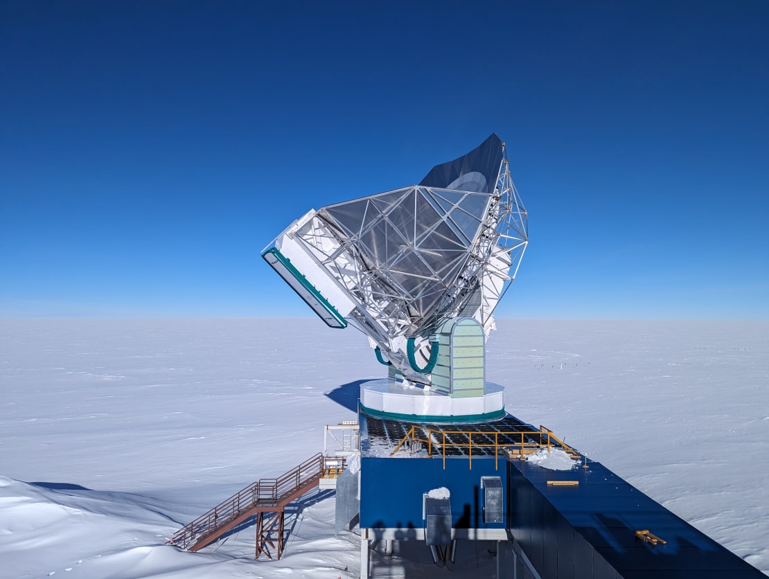 South Pole Telescope with bright blue sky in background.