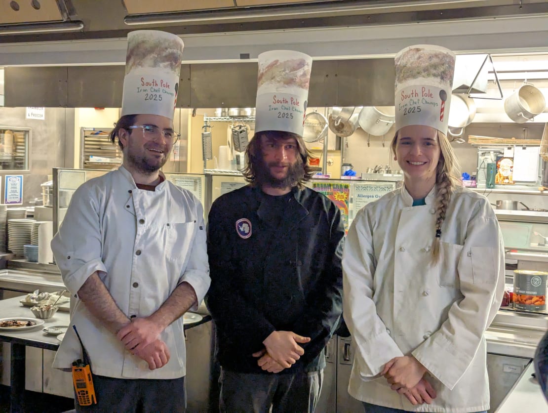 Group photo of three winning chefs in toques.