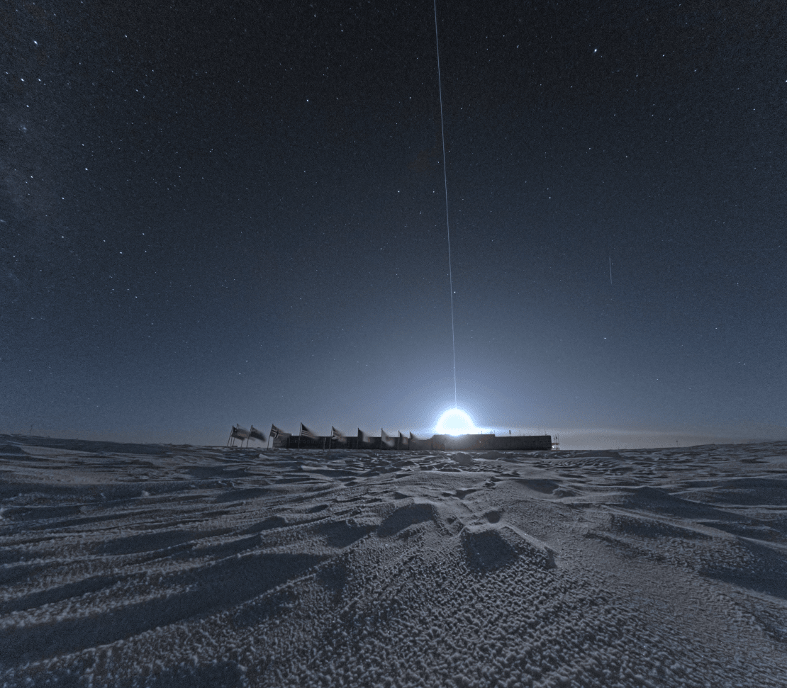 A very bright moon peeking above the South Pole station.