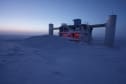 Brightening sky at sunrise as backdrop to the IceCube Lab.