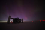 The IceCube Lab at night post sunset, with faint light lingering along horizon in background.