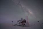 The IceCube Lab with frosted exterior in winter, Milky Way seen overhead.