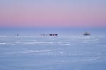 Hazy pink sky at twilight over Dark Sector at the South Pole.