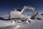 An idle snow-crusted Cat digger stored out in the field at the South Pole.