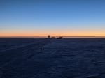 Clear blue sky changing to orange along the horizon at the South Pole sunset.