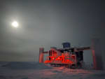 Full moon and cloudy sky over the IceCube Lab.