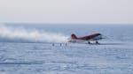 A small plane on the ice just upon landing at the South Pole.