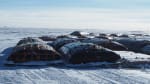 Large fuel bladders parked on the ice at the South Pole.]