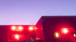 South Pole station with brightening sky at twilight.