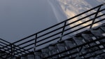 Long shadow of IceCube Lab in early sunrise.