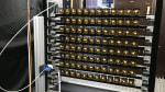 PMT testing facility at RWTH Aachen University. Shown here are 92 mDOM PMTs mounted on a custom rack in front of an illumination sphere.