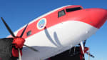 Close-up, three-quarter view of a Basler plane parked on the ice.