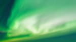 Bright green auroras filling the skies.