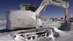 An idle snow-crusted Cat digger stored out in the field at the South Pole.