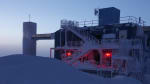 Brightening sky at sunrise as backdrop to the IceCube Lab.