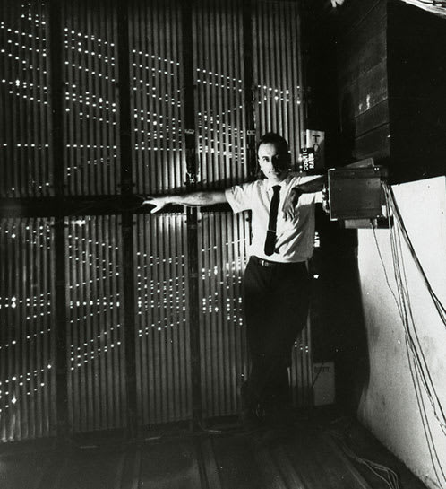 Melvin Schwartz with the 10-ton spark chamber, showing a multiple exposure of cosmic-ray muon tracks.