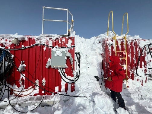 Snow accumulated high between storage containers