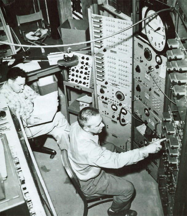 Fred Reines and Clyde Cowan, at the controls of the Savannah River experiment.