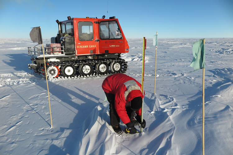 Taking snow depth measurements