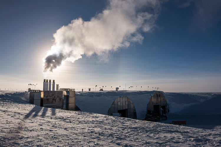 sun behind powerplant