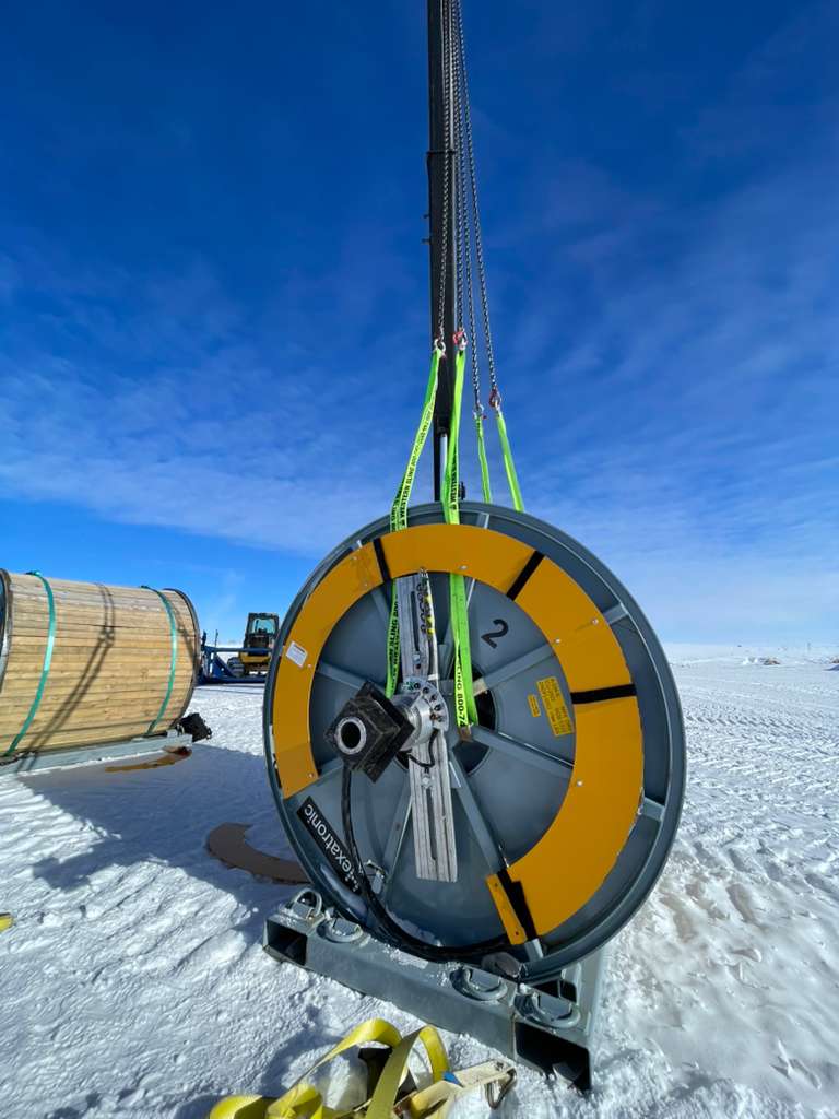 Large round end to cable spool on crane.