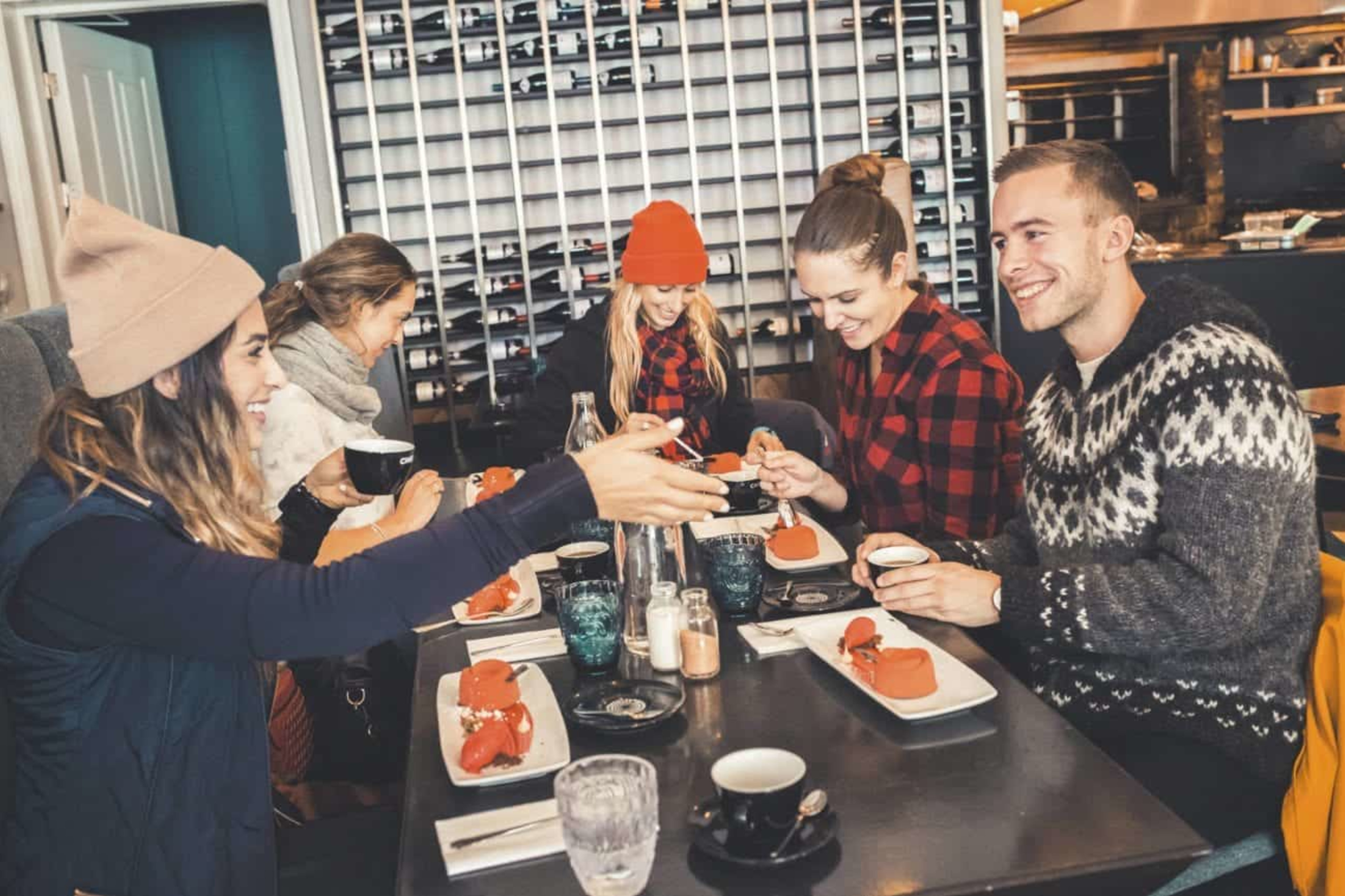 Group of people enjoying meal in restaurant