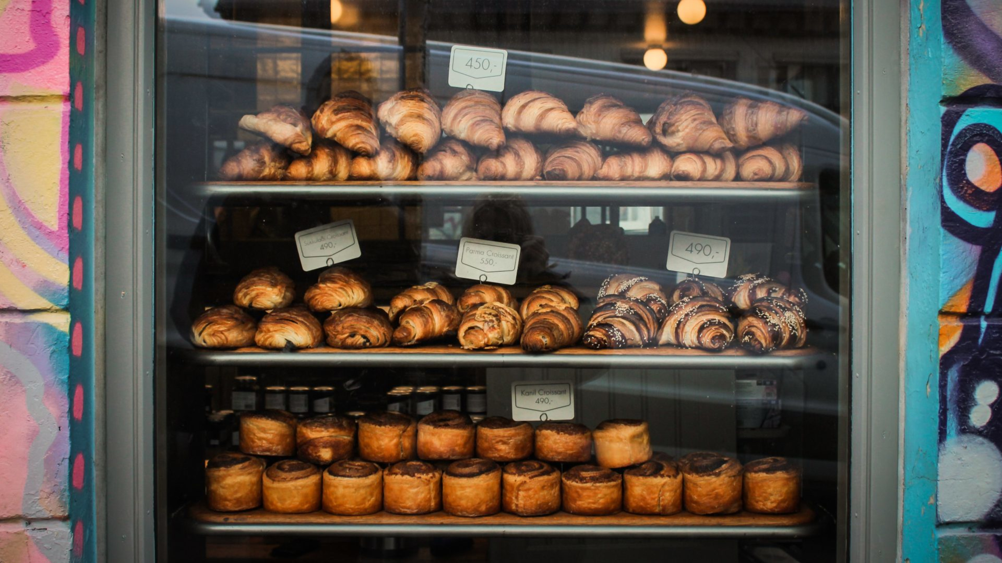 Cinnamon buns and croissants in a bakery window in Reykjavík