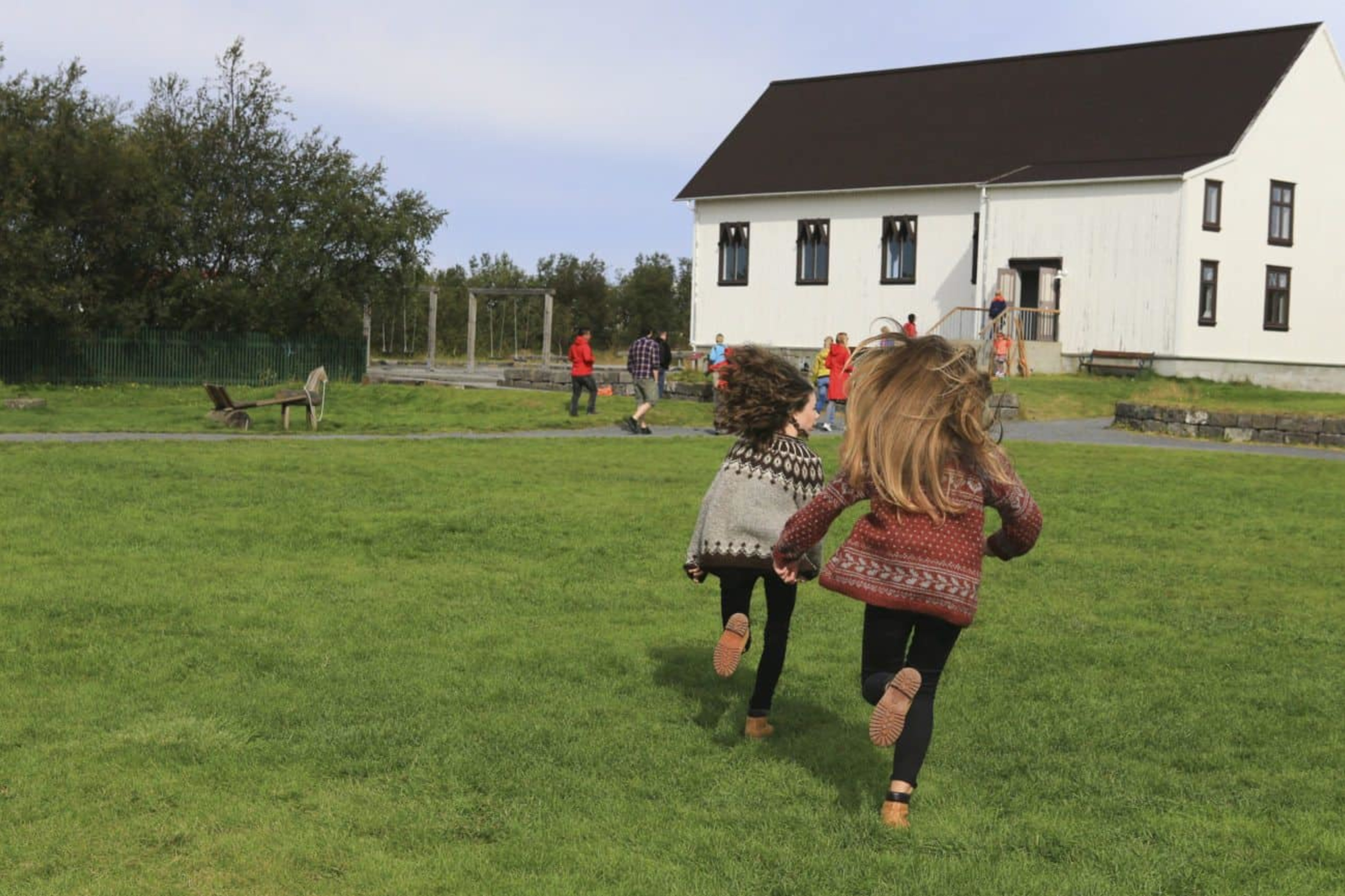 Children running in the Icelandic countryside