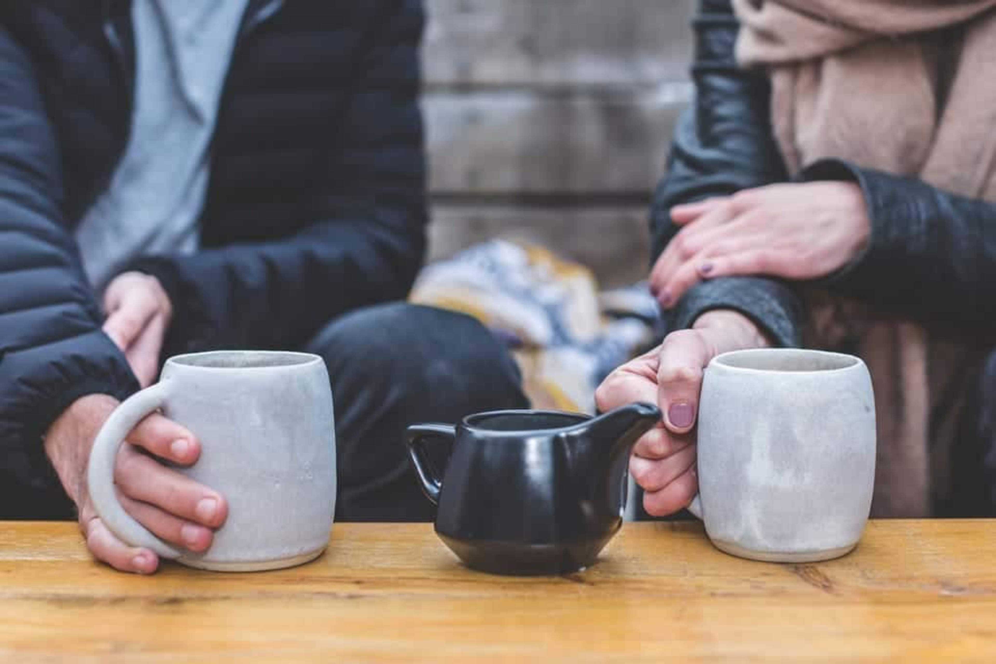 Friends meeting and drinking tea