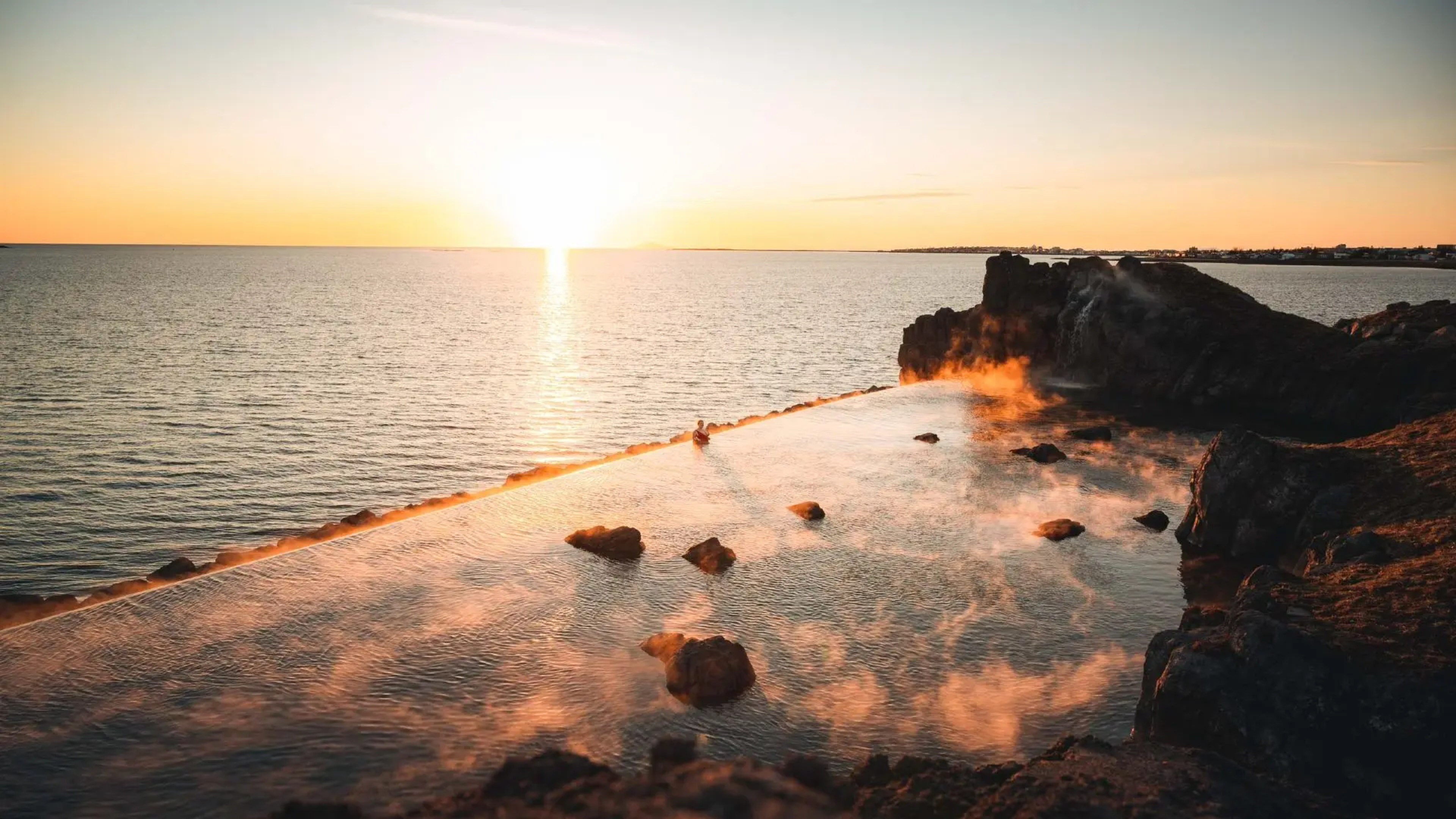 Sky Lagoon at sunset in Iceland.