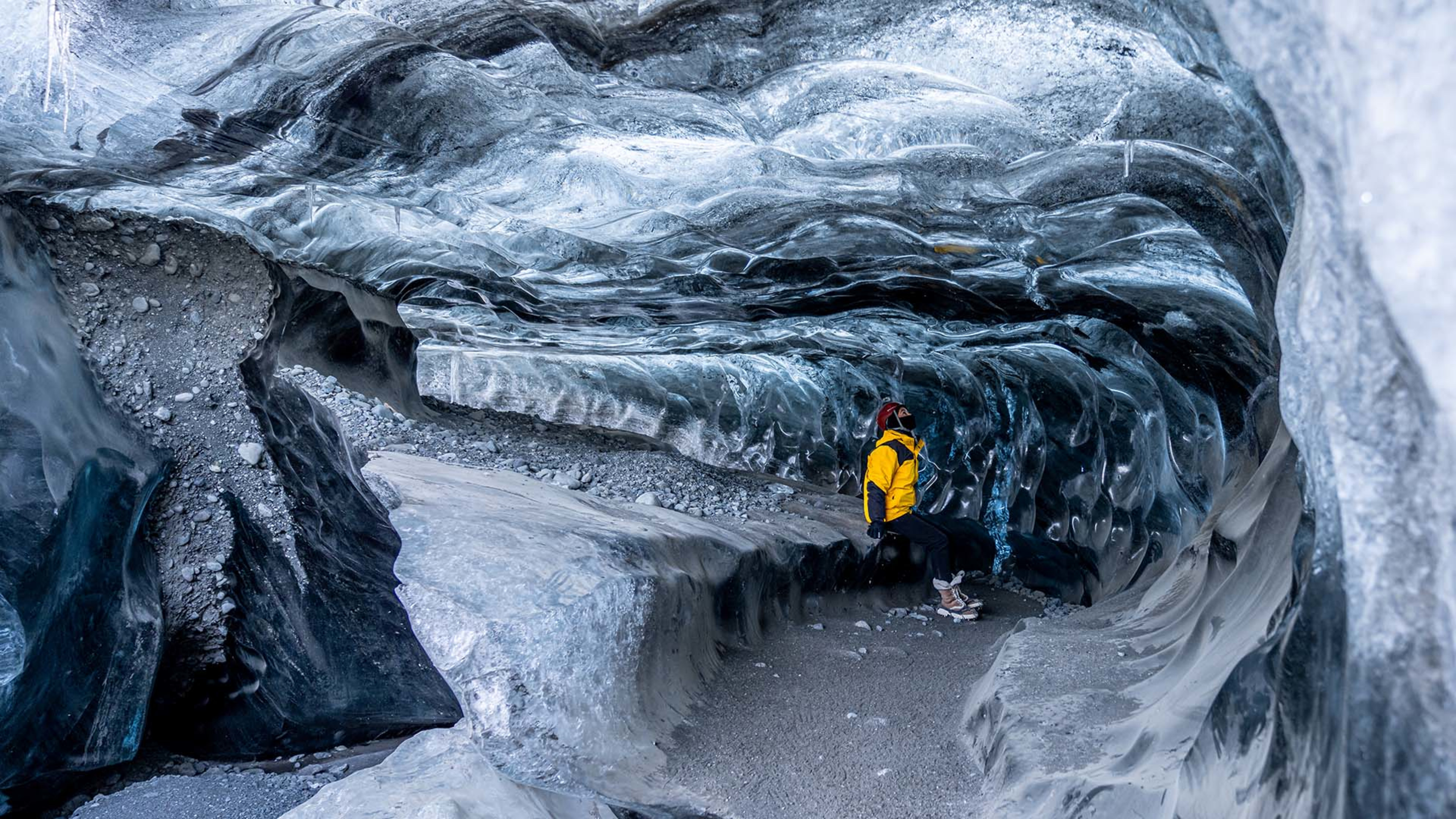 Person standing inside Vatnajökull ice cave © Matthew Shearer