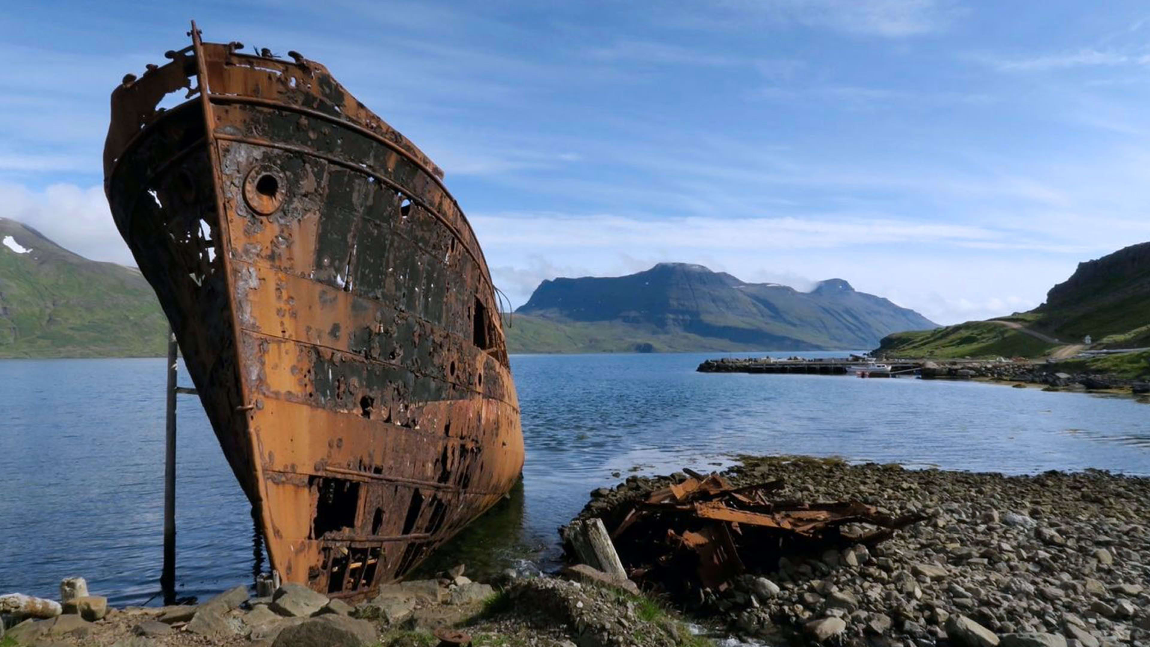 A rusty shipwreck in the village of Djúpavík in the Westfjords