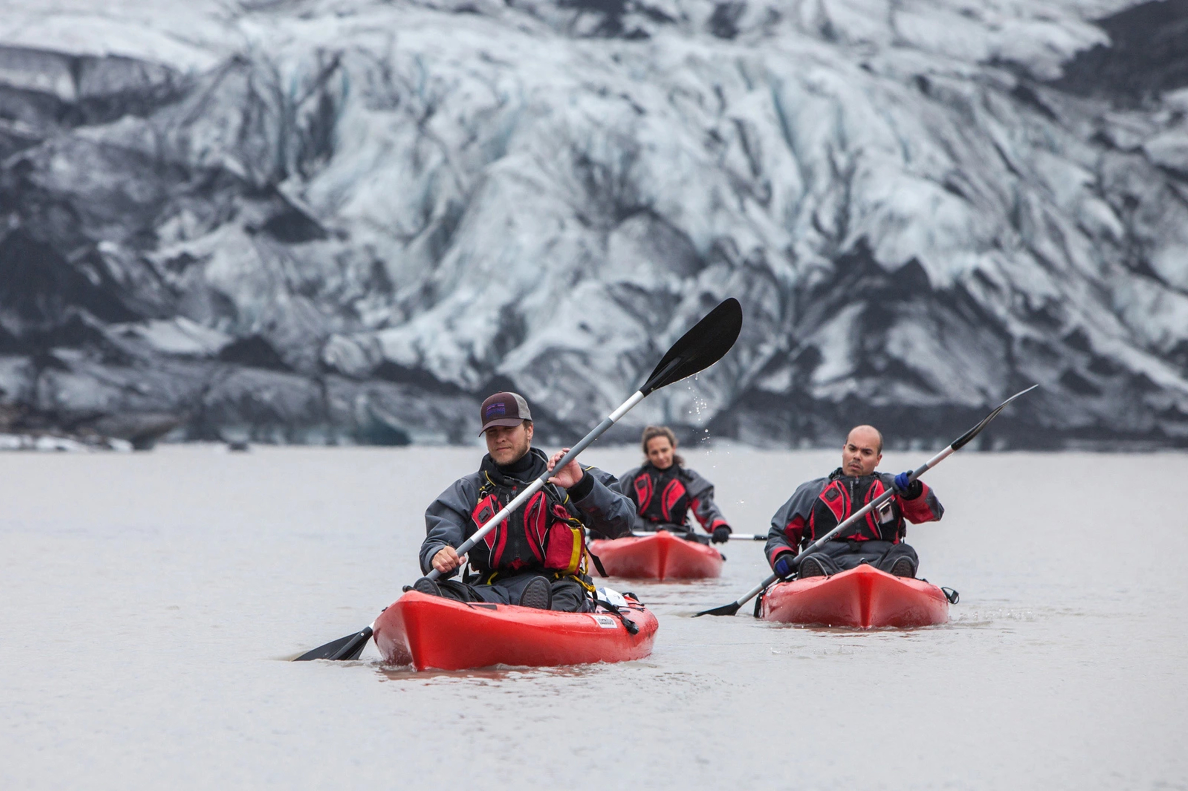 Group of people kayaking by the Glacier