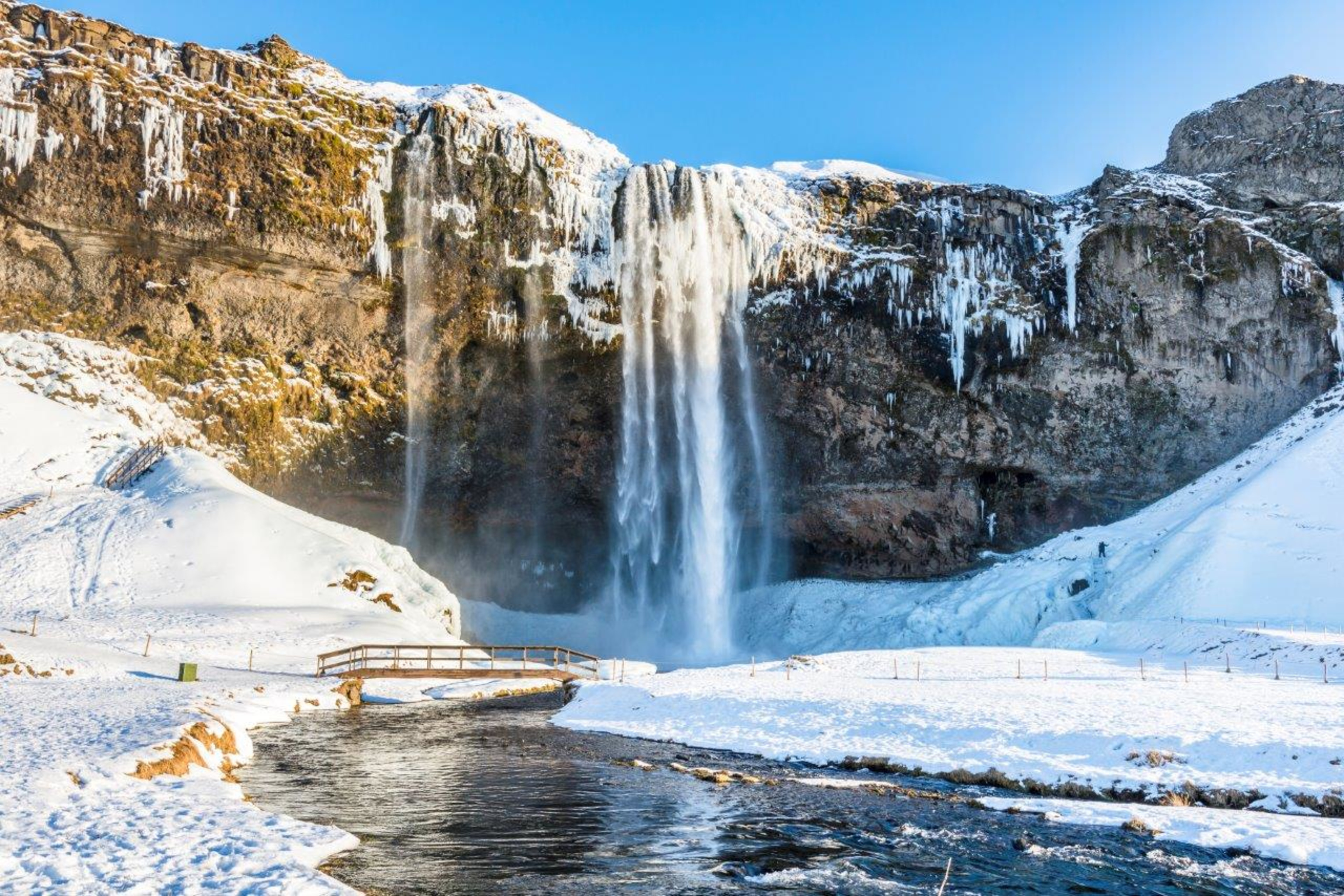 Seljalandsfoss waterfall covered in snow and ice