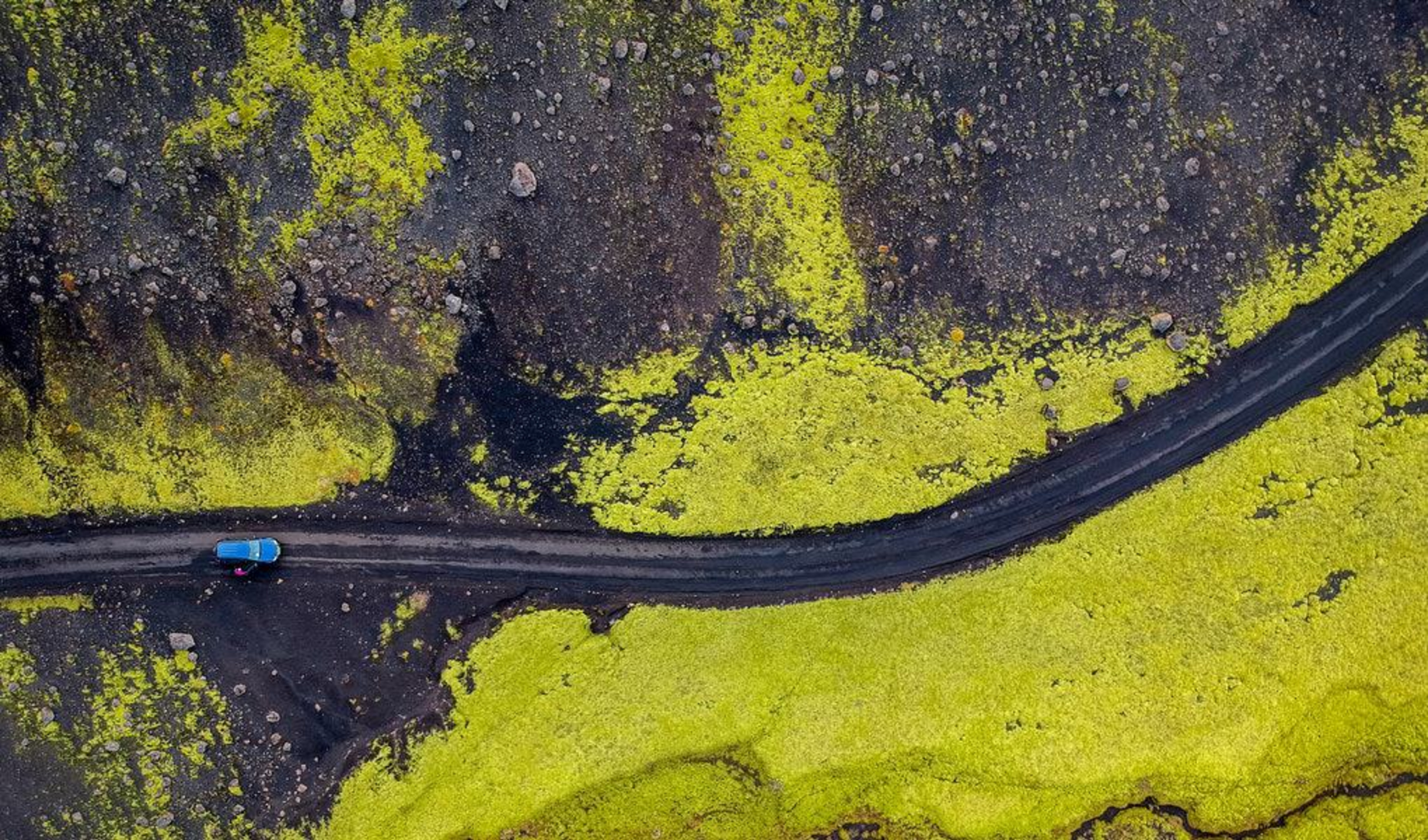 Aerial view of a car on icelandic road