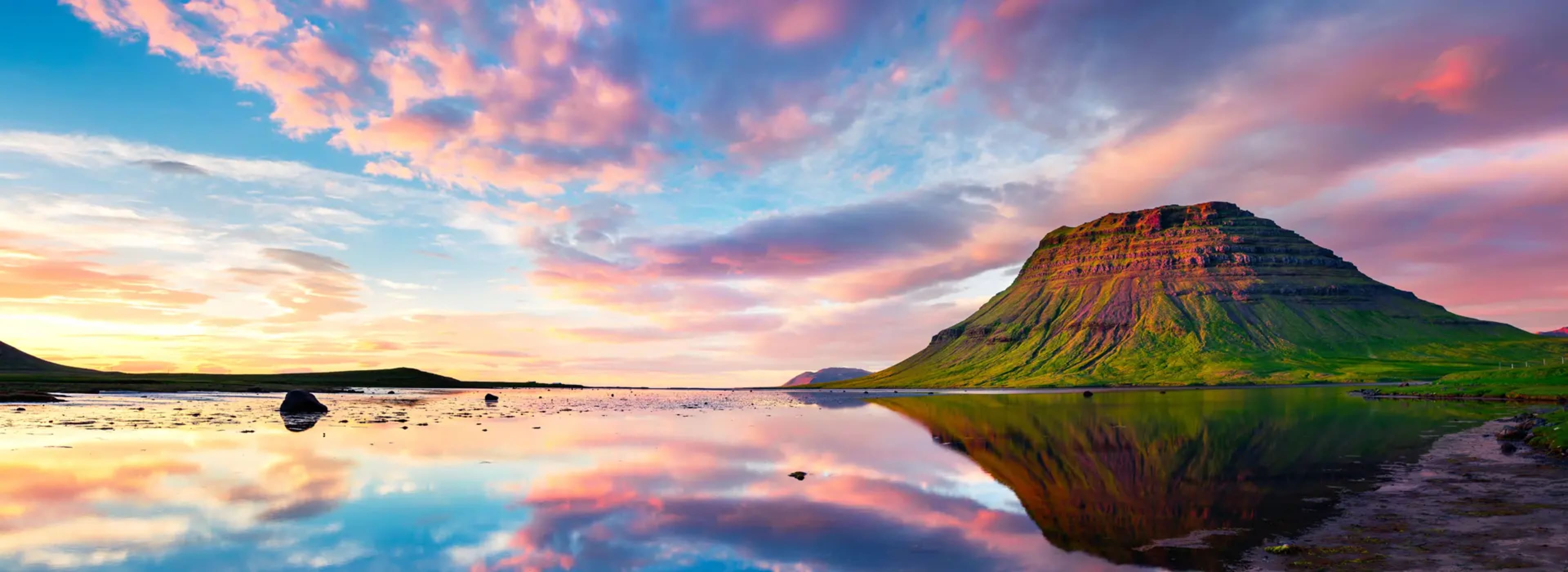 Colorful summer sunset over the Kirkjufell mountain