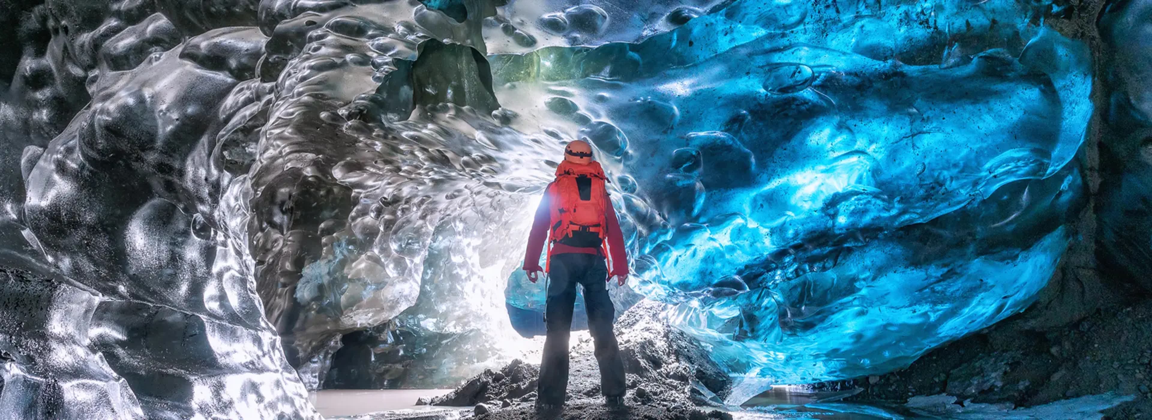 Person standing in an ice cave in Vatnajokull glacier, Iceland