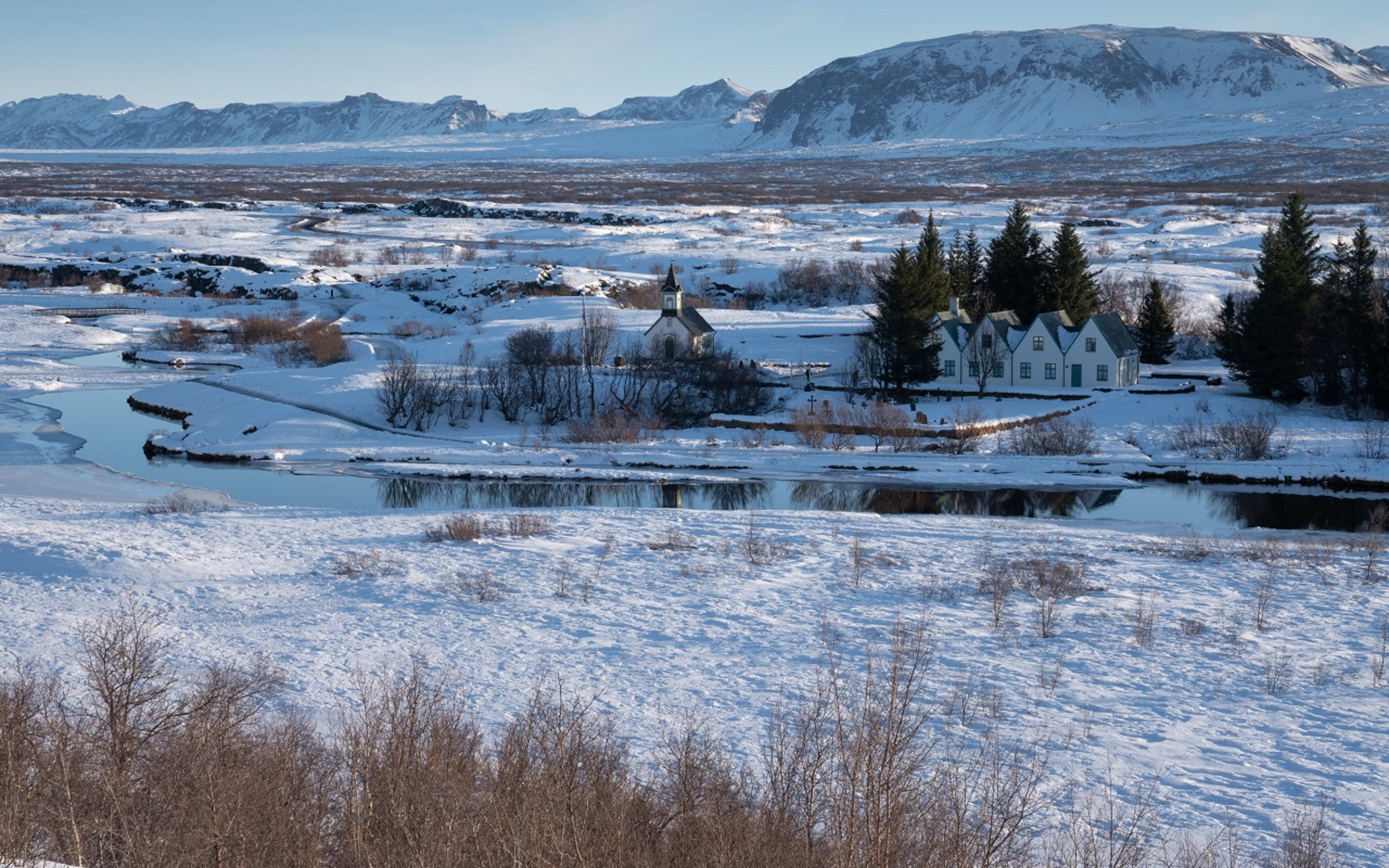 Thingvellir National Park covered in snow with blue skies above