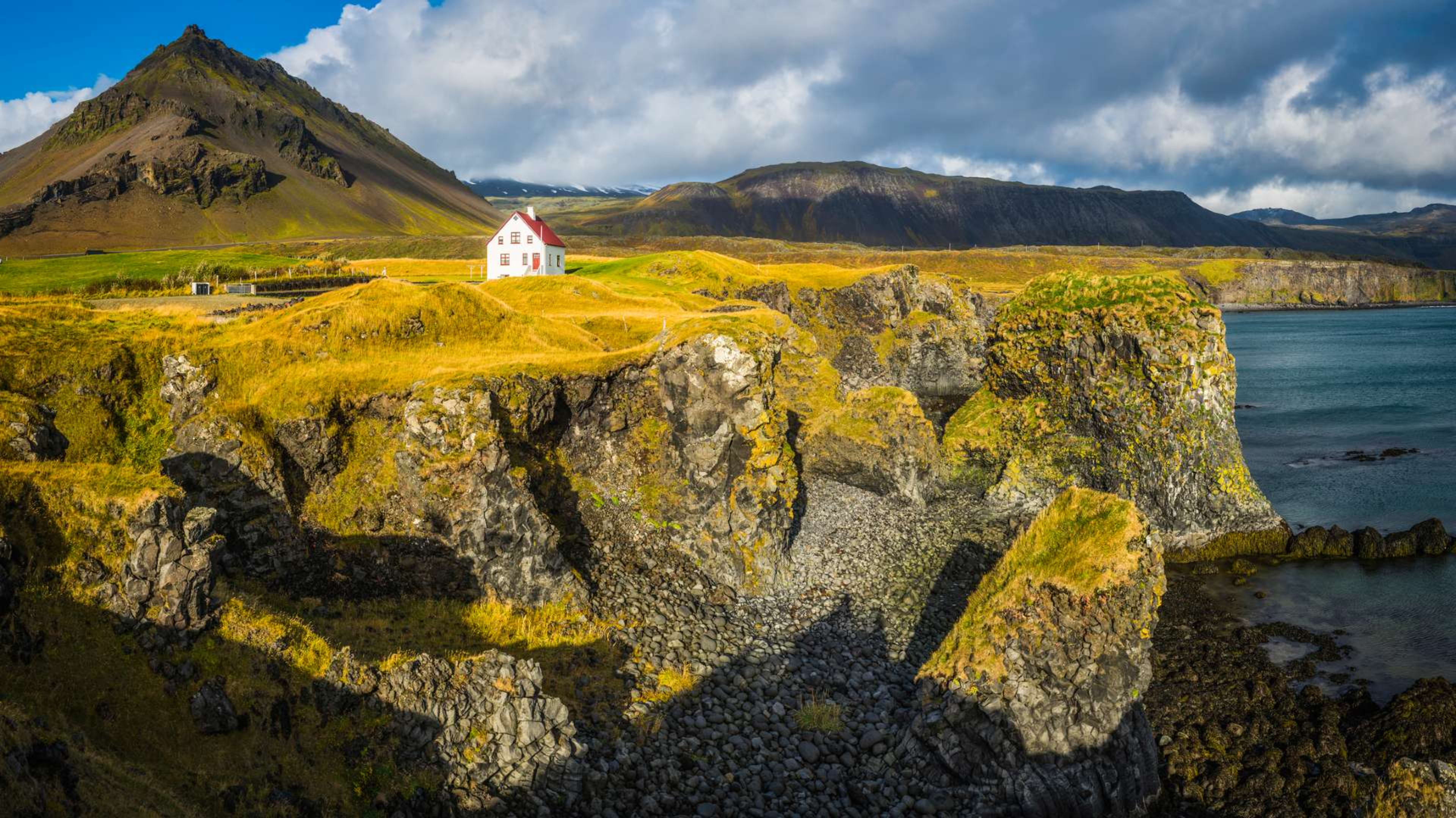 A house atop a cliff at Arnarstapi