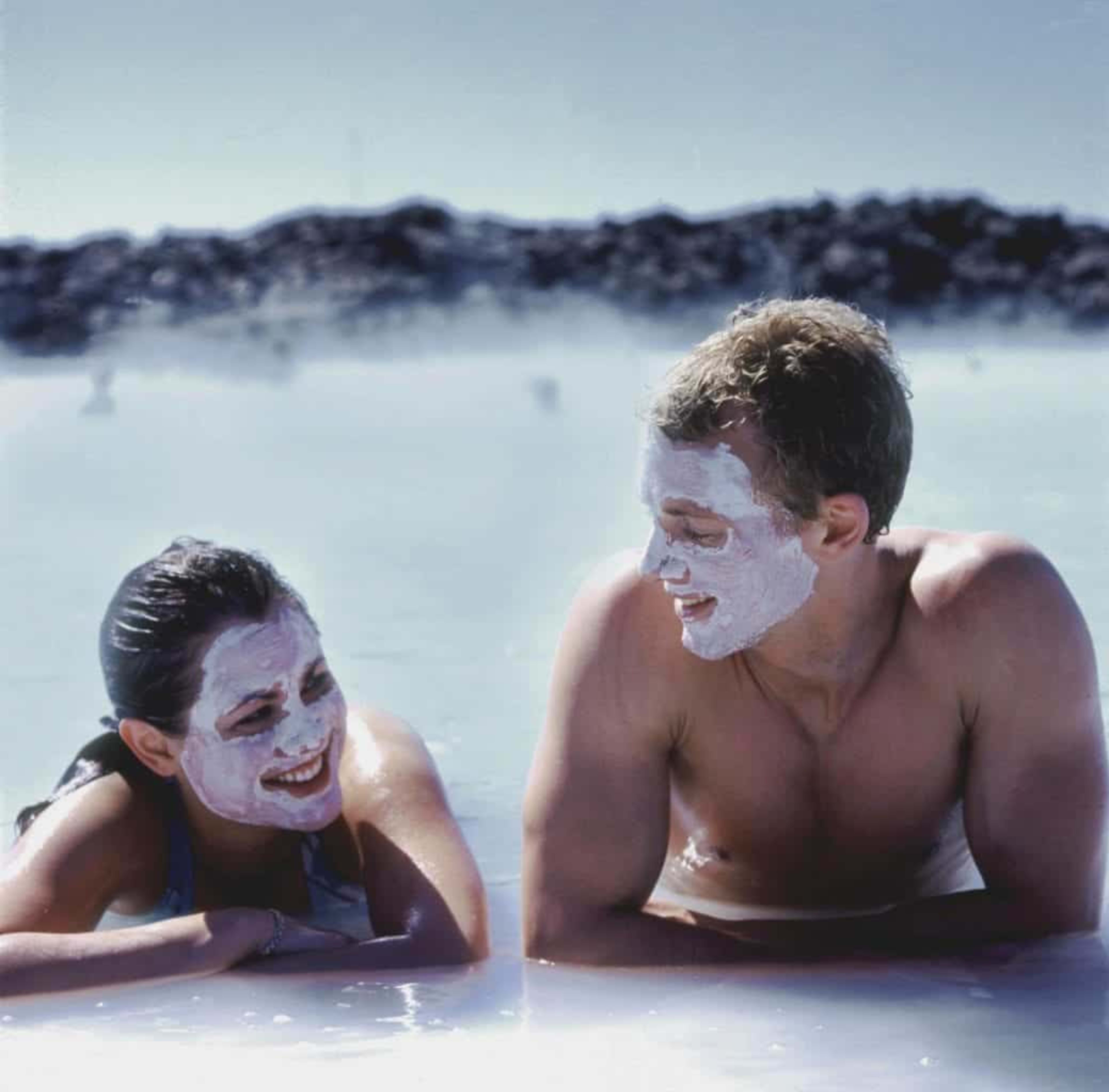 Couple relaxing in the thermal pool of Blue Lagoon