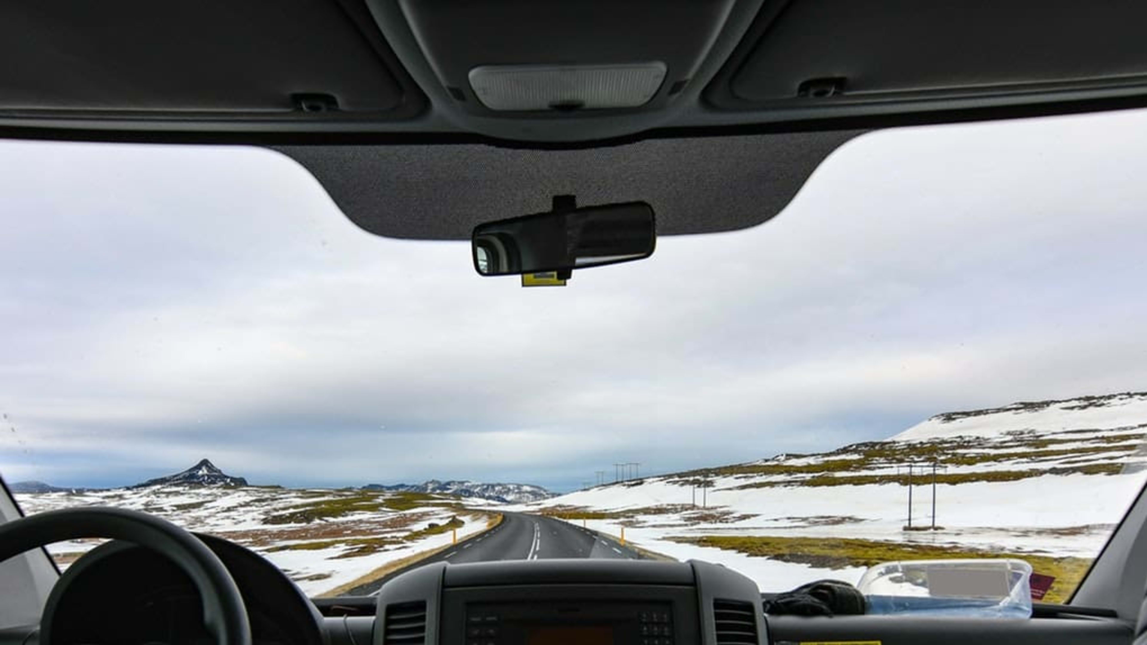 View from inside of car from rear seat.