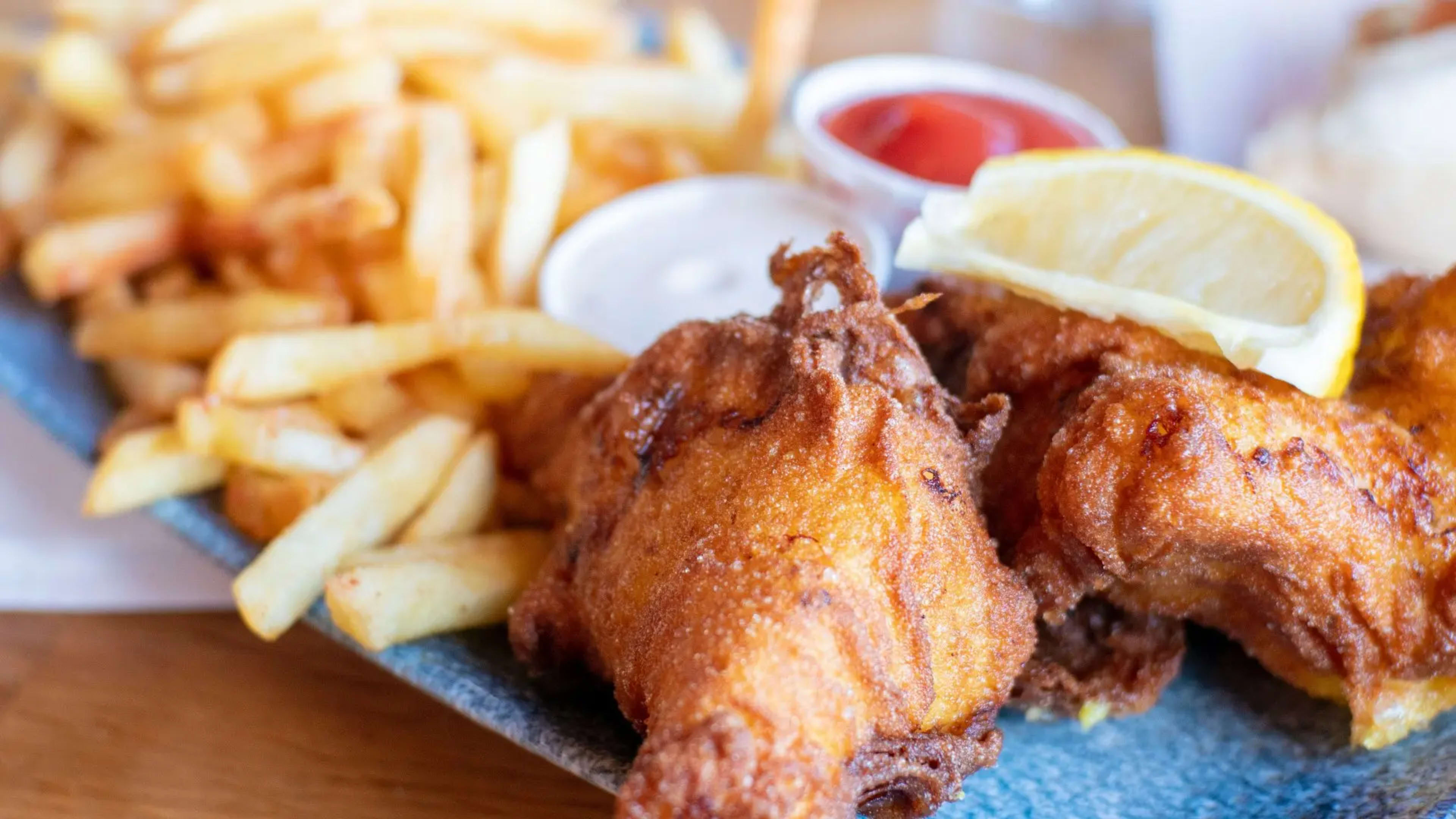 battered fish and chips with sauces