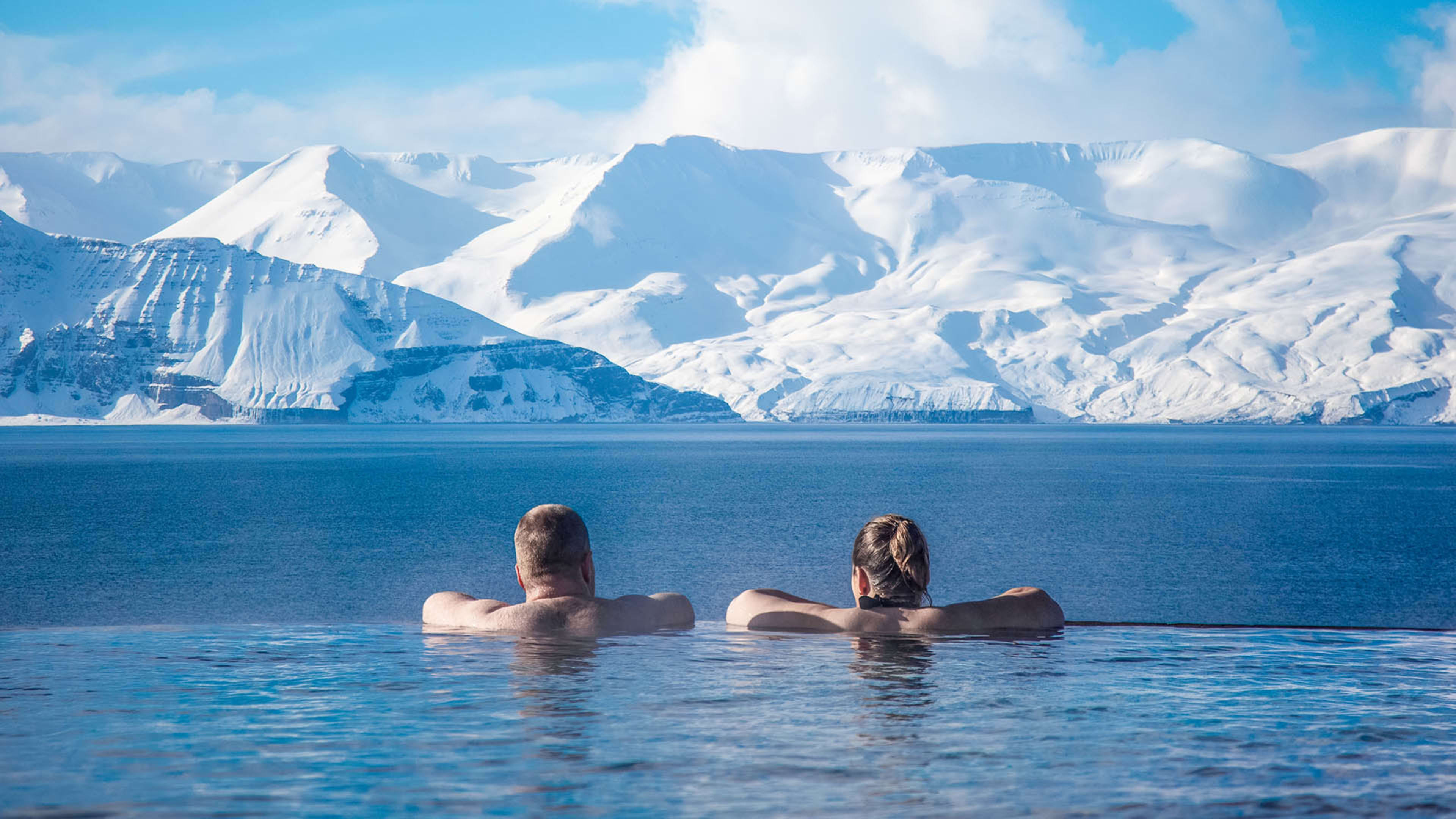 A couple in the GeoSea baths in winter