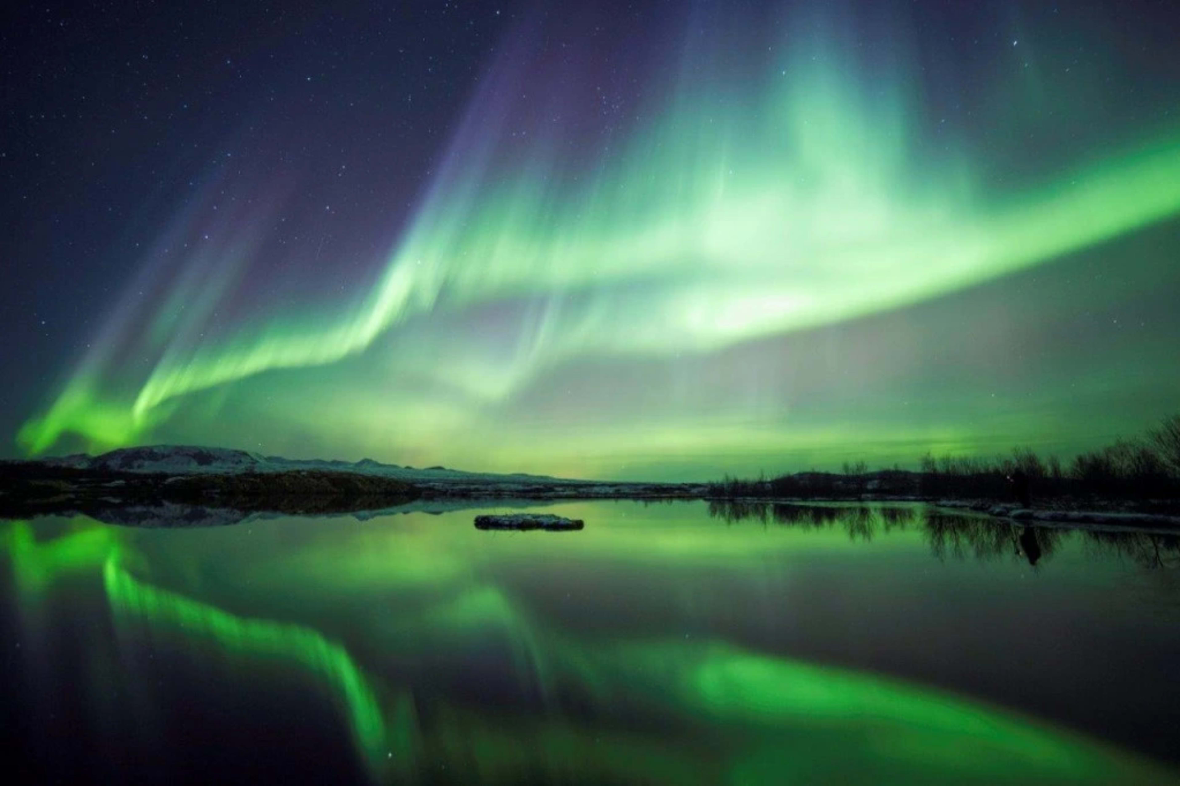 Northern lights over the lake in Iceland