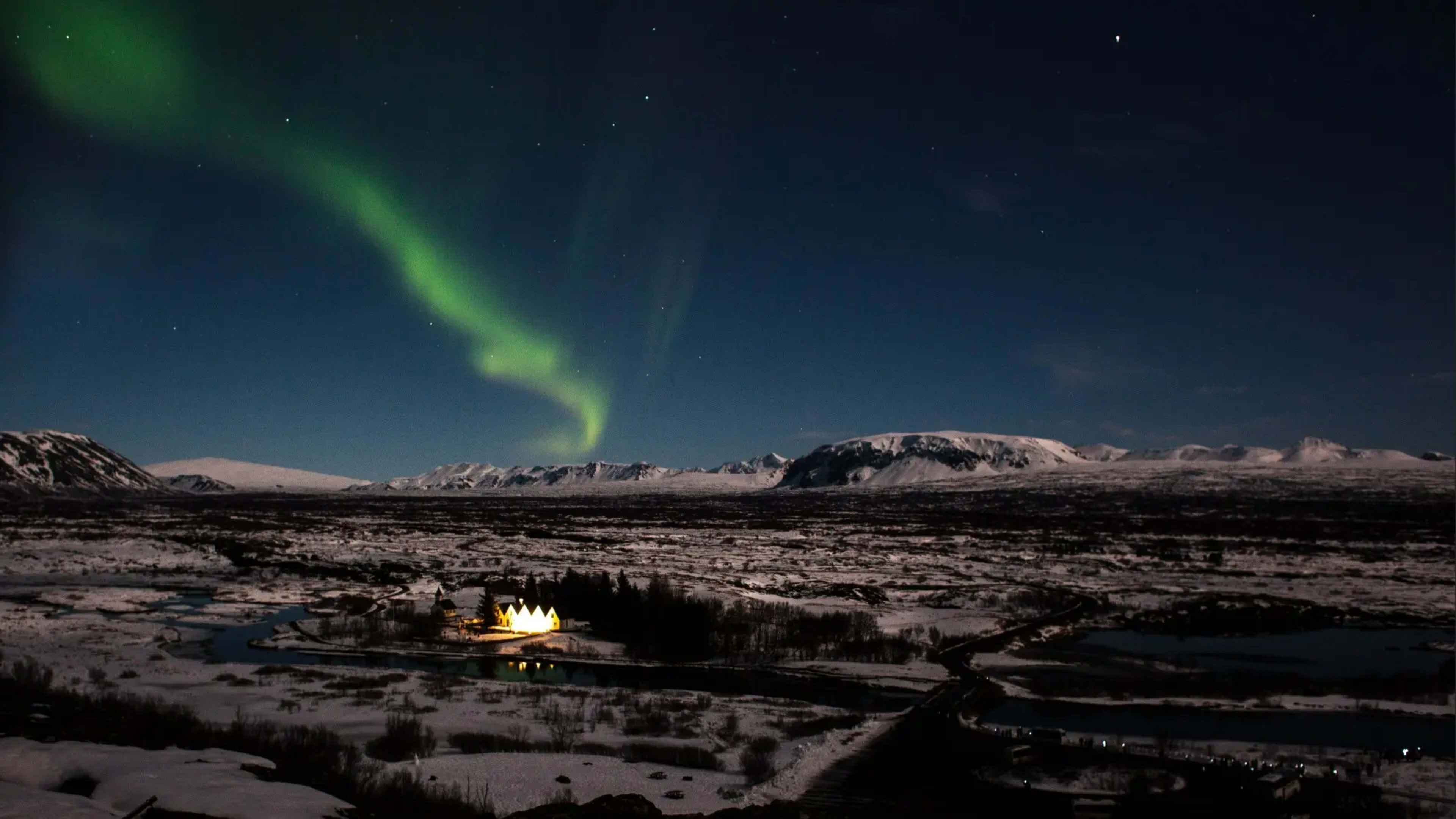 Ribbons of the Northern Lights in the sky above Thingvellir National Park